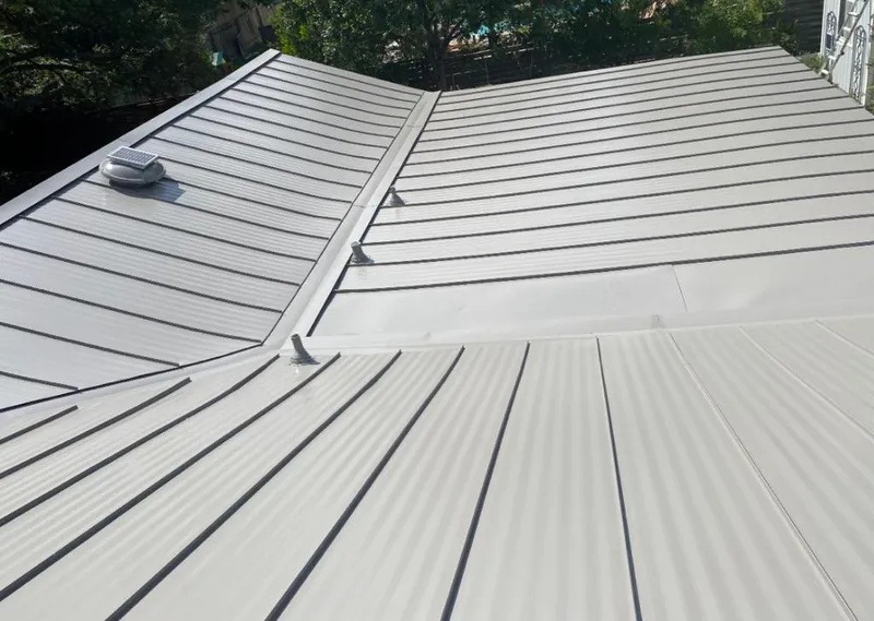 Solar attic fan installed on a metal roof for Roof Ventilation in Union Hill-Novelty Hill